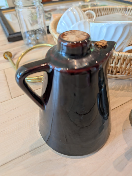 Dark brown glazed pottery pitcher