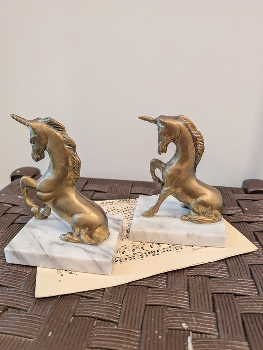 Matching pair of vintage Hollywood Regency solid brass unicorn bookends